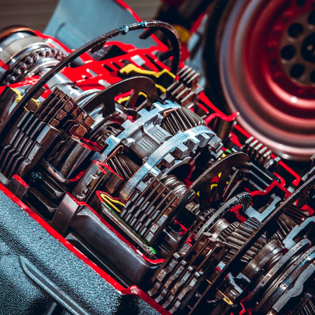 Parts from a vehicle gearbox. Shallow depth of field with the nearest gear in focus.